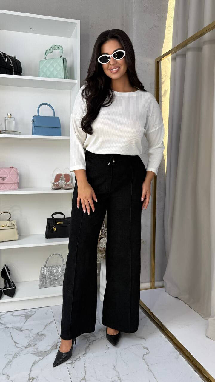 Брюки високої посадки з косими кишенями