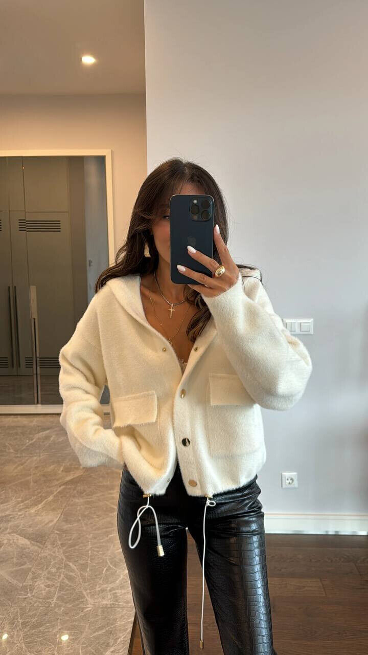 Хутряна кофта з кишенями 