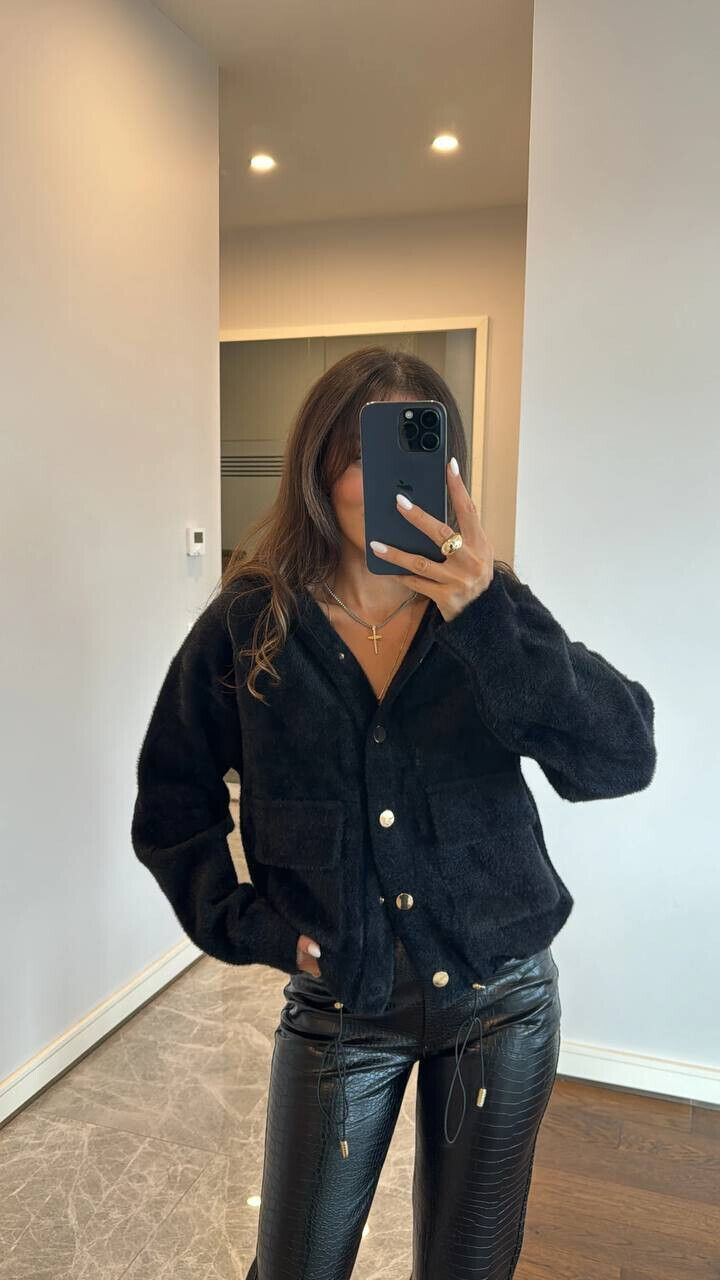 Хутряна кофта з кишенями 